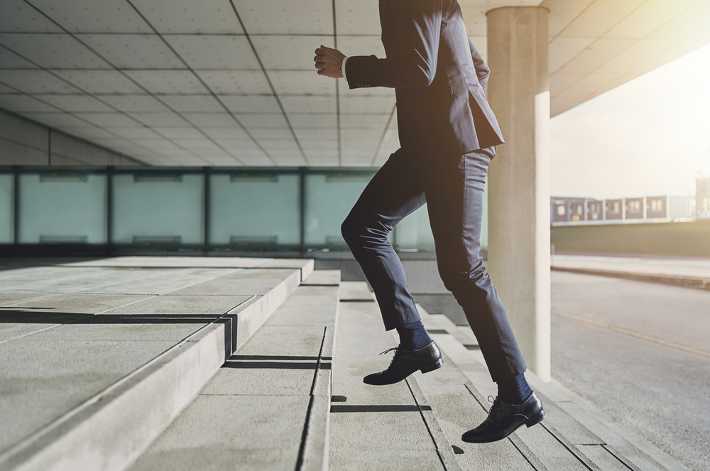 Businessman,Running,Fast,Upstairs.,Horizontal,Outdoors,Shot.