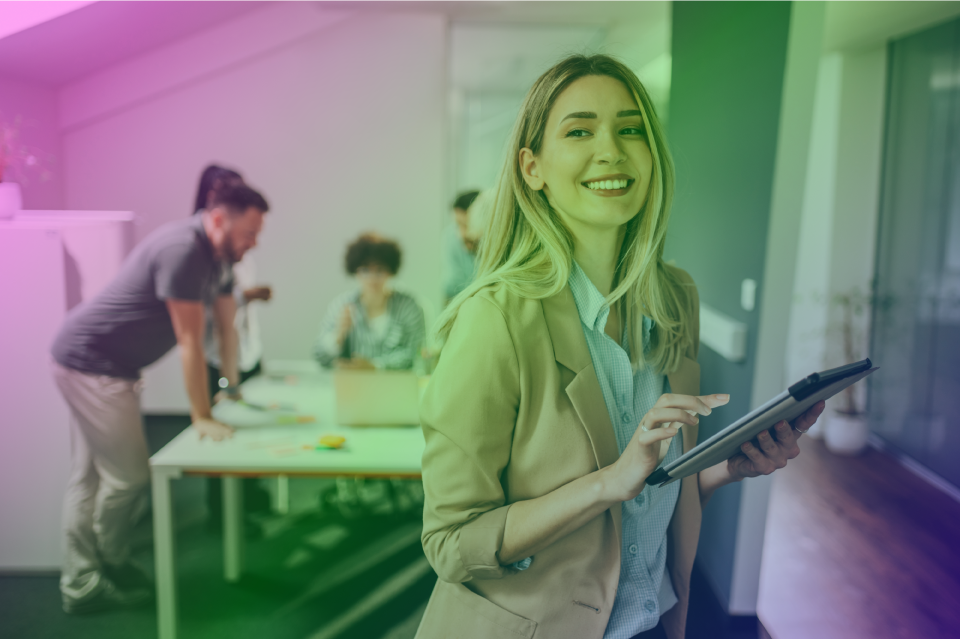 Professionals in an office using Microsoft 365 M365 managed services.
